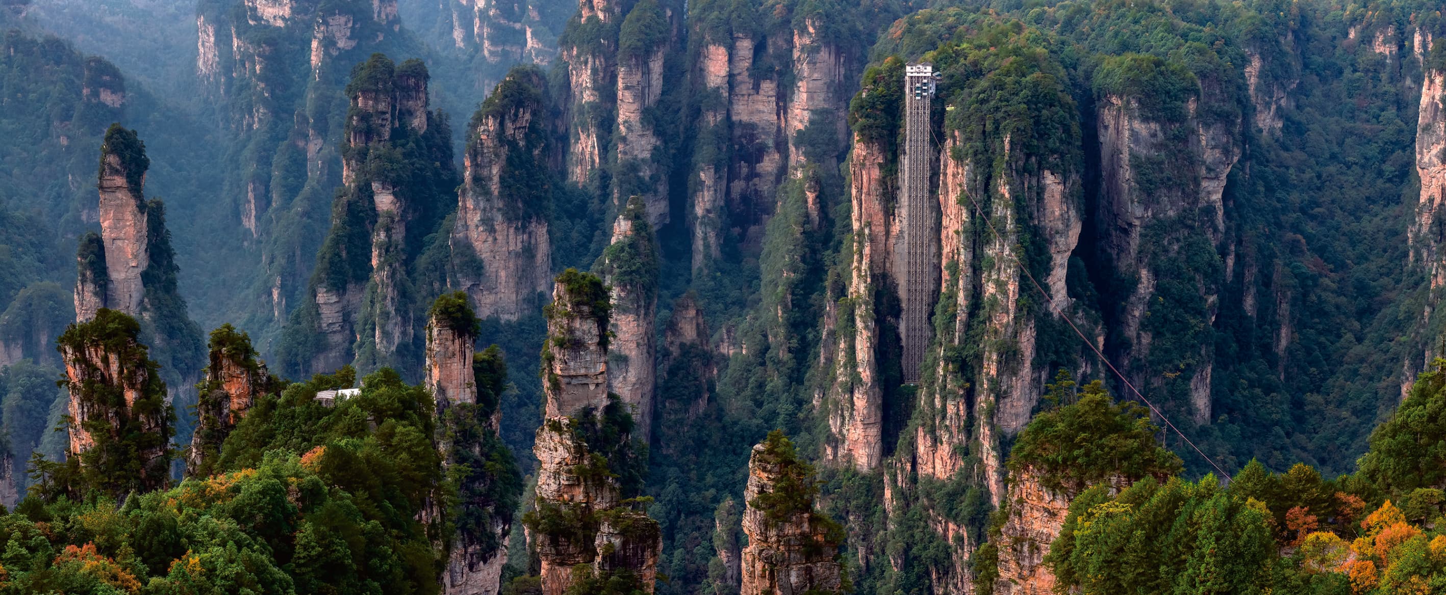Official Tour Guide Manual panorama of the Bailong Elevator among Zhangjiajie's sandstone pillars