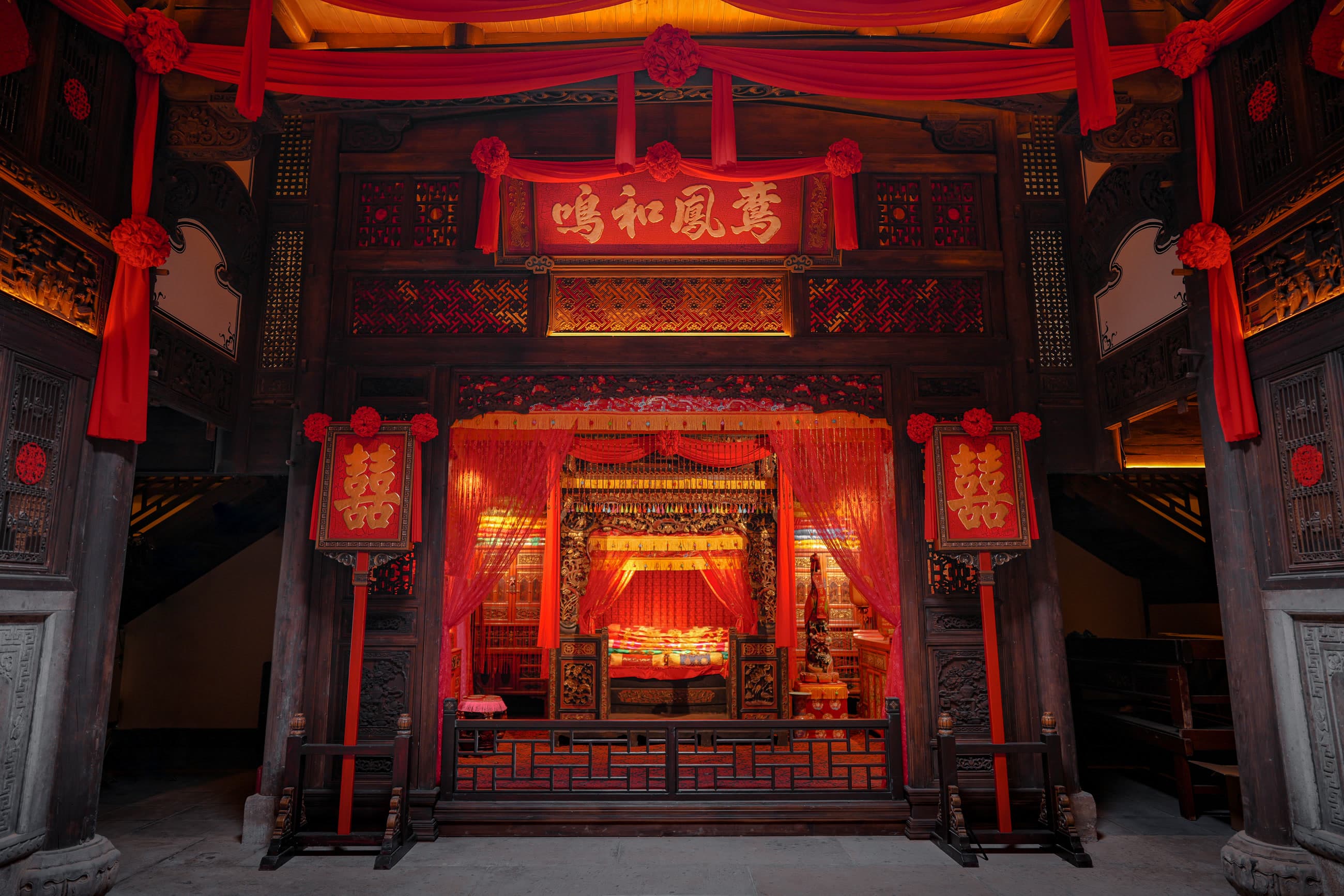 Red ceremonial wedding-room display inside Xiangxifu