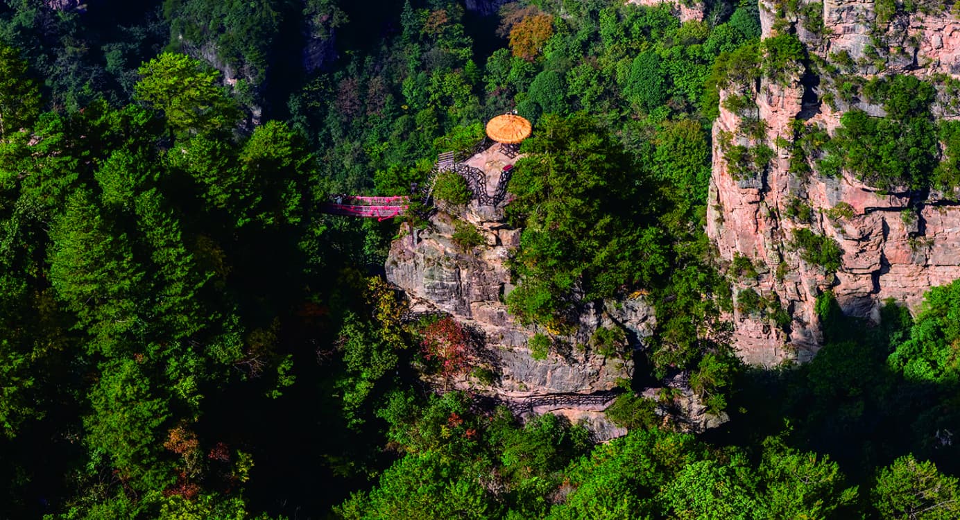 Tianbo Mansion viewpoint set among forest and sandstone cliffs in Yangjiajie