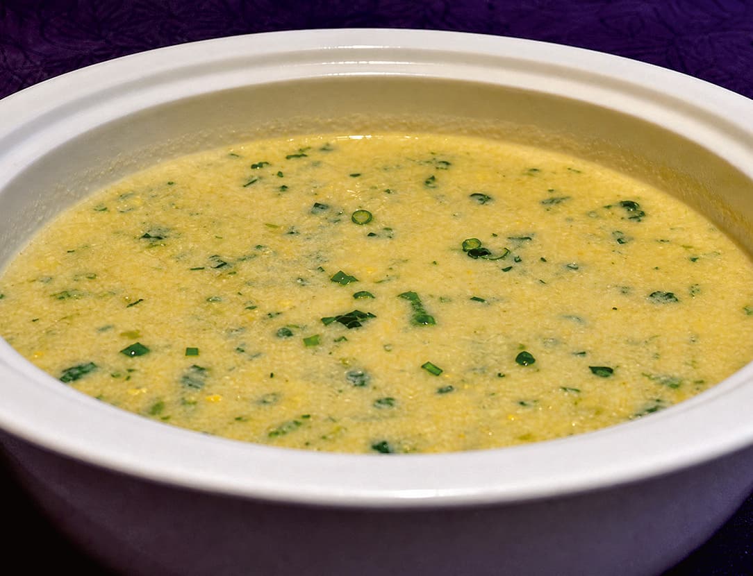 Hezha, a Tujia soybean and vegetable dish, in the official Tour Guide Manual.