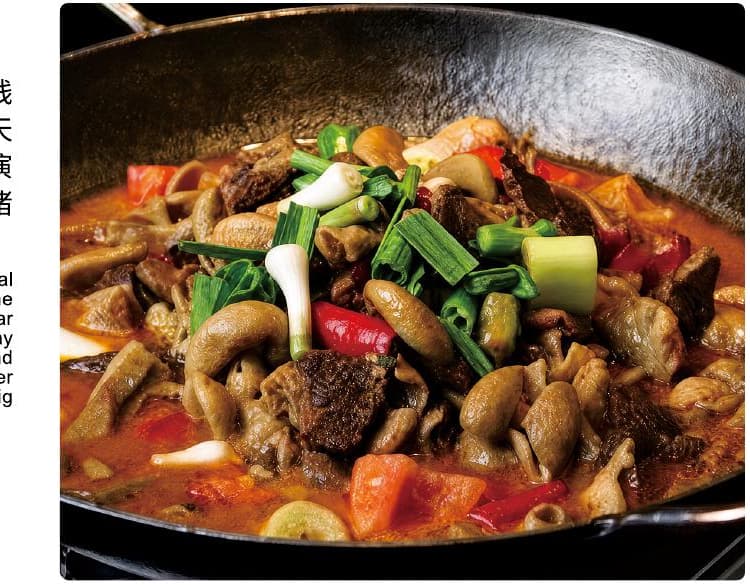 A Tujia mixed dish documented in the official Tour Guide Manual.